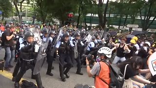 Protesters and police clash in Hong Kong after peaceful march