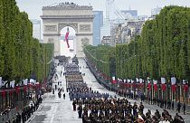 Troops walk down the Champs-Elysees avenue during the Bastille Day parade, Wednesday, July 14, 2021 in Paris.