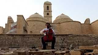 How is Iraqi cellist Karim Wasfi using music to fight terrorism?