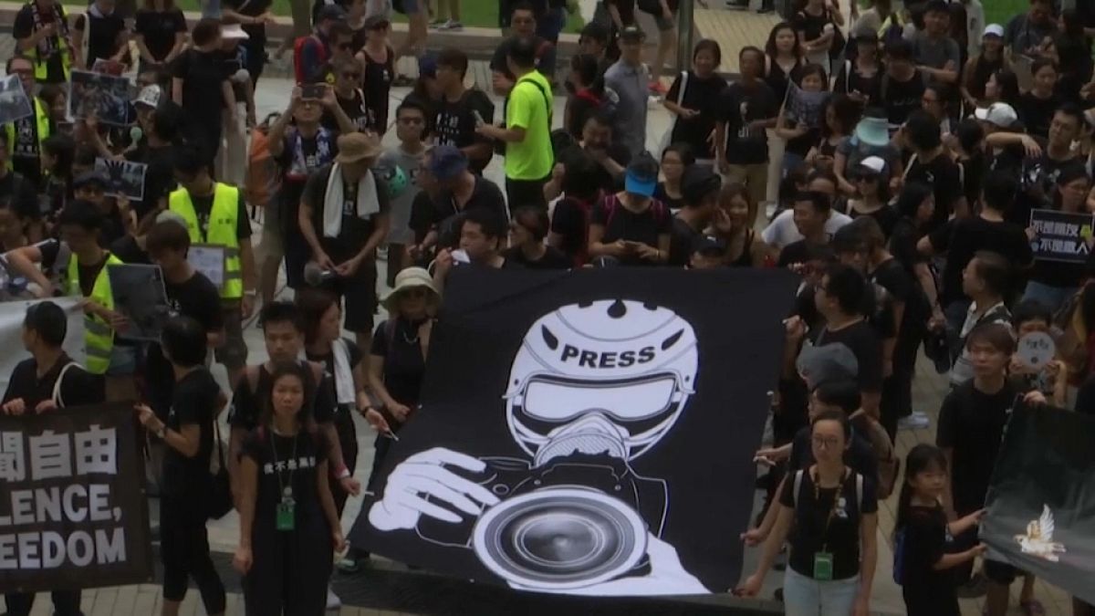 Hong Kong protests: Journalists hold 'silent march' against alleged police violence
