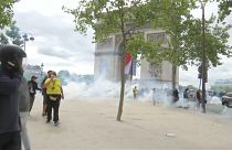 French police fire tear gas as protests follow Bastille Day parade