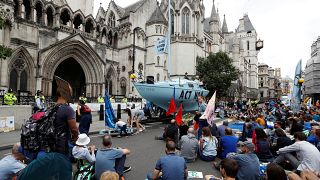 Extinction Rebellion climate activists hold a protest outside the Royal Courts of Justice in London, Britain July 15, 2019