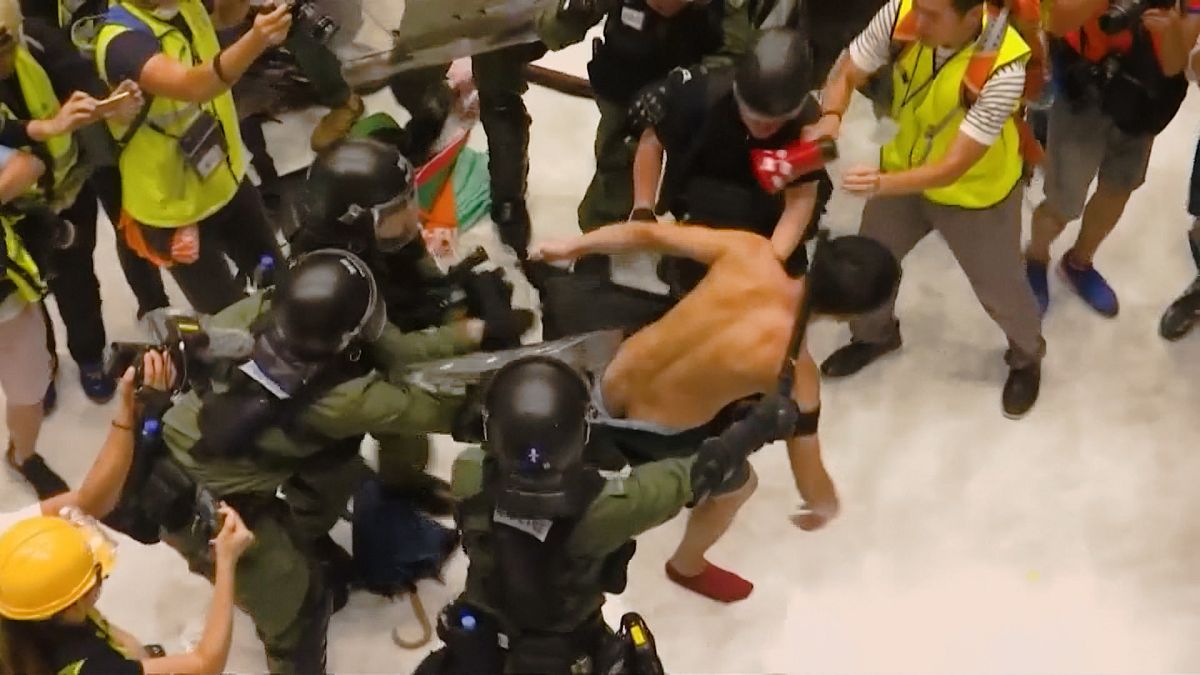 Riot police clash with protesters inside Hong Kong mall