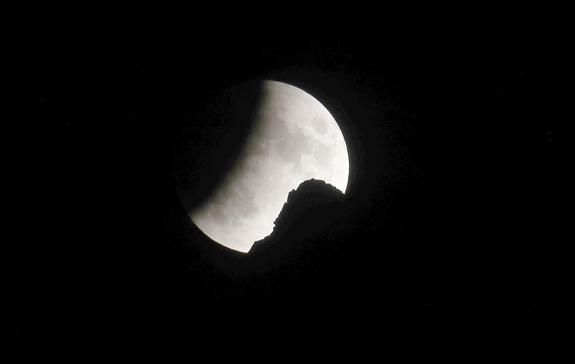 In pictures: Partial lunar eclipse on 50th anniversary of Apollo 11 ...