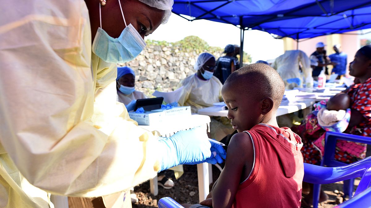 A Congolese health worker administers ebola vaccine to a child at the Himbi Health Centre in Goma, Democratic Republic of Congo, July 17, 2019