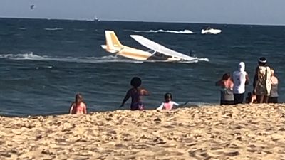Plane makes emergency landing in shallows off Maryland beach