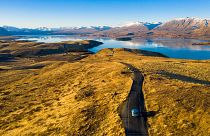 Wiebe Wakker drives his electric vehicle along Lake Tekapo, New Zealand