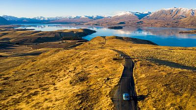 Wiebe Wakker drives his electric vehicle along Lake Tekapo, New Zealand Wiebe Wakker drives his electric vehicle along Lake Tekapo, New Zealand