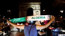 Algeria fans celebrate in front of the Arc de Triomphe in Paris after the match