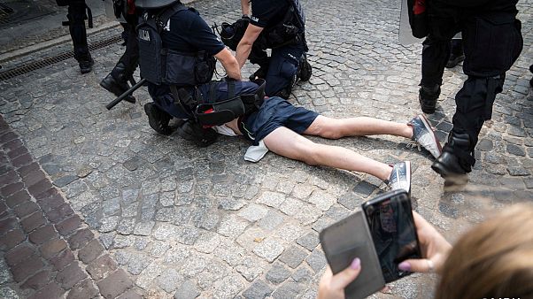 A photo posted on social media of police arresting an anti-LGBT protester A photo posted on social media of police arresting an anti-LGBT protester