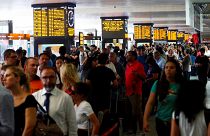 Passengers waiting at Termini station in Rome, after a fire hit the infrastructure around Florence