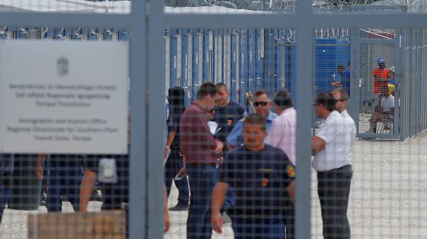 Migrants wait in the transit zone where their asylum claims are processed in Tompa, Hungary, June 14, 2017. Migrants wait in the transit zone where their asylum claims are processed in Tompa, Hungary, June 14, 2017.