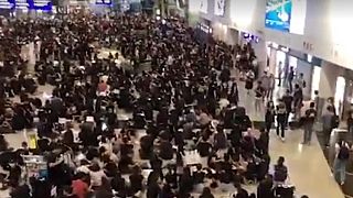Watch live: Protesters hold mass sit-in at airport