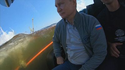 Putin explores sunk Soviet submarine in Bond-style dive