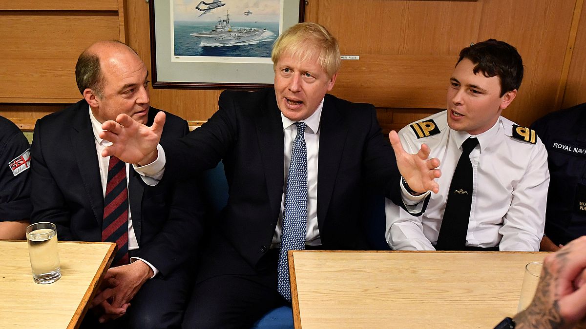 Boris Johnson and Defence Secretary Ben Wallace meet crew members in the mess hall as they visit HMS Victorious at HM Naval Base Clyde in  Scotland, Britain July 29, 2019