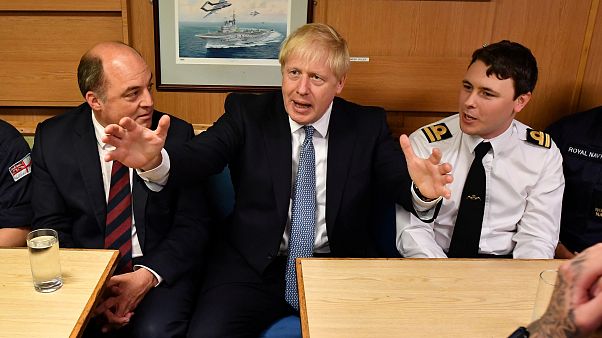 Boris Johnson and Defence Secretary Ben Wallace meet crew members in the mess hall as they visit HMS Victorious at HM Naval Base Clyde in Scotland, Britain July 29, 2019
