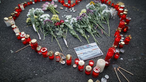Flowers and candles are left by people during an anti-government demonstration in Bucharest, Romania, July 27, 2019. Flowers and candles are left by people during an anti-government demonstration in Bucharest, Romania, July 27, 2019.