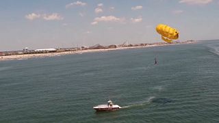 Watch: Basketball star Julian McClurkin scores trick shot while parasailing