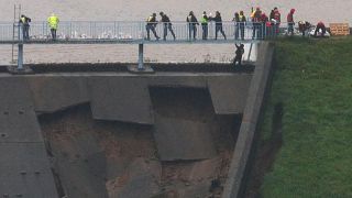 British military helping shore up damaged dam as risk of flooding of UK town rises 