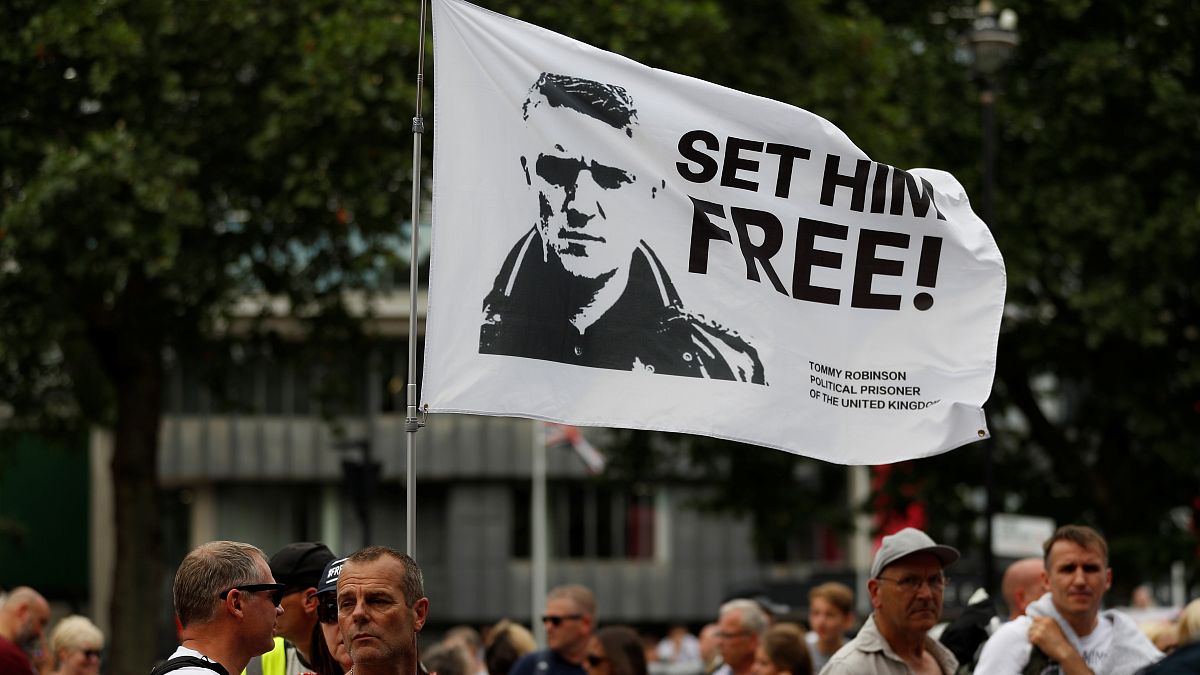 Supporters of far-right activist Tommy Robinson protest outside the Houses of Parliament in London, July 11, 2019. 