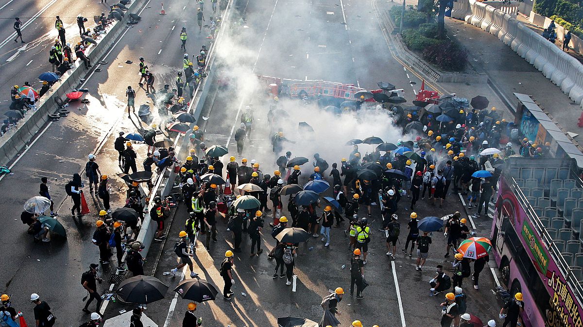 Demonstrators disperse after a tear gas is fired by Hong Kong police in Hardcourt Road, Admiralty, in Hong Kong, China, August 5, 2019. 