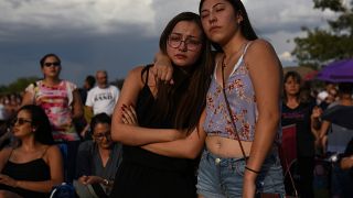 Amber Ruiz and Jazmyn Blake embrace during a vigil a day after a mass shooting at a Walmart store in El Paso, Texas, U.S. August 4, 2019.