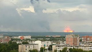 Spectacular explosions after fire at Russian arms depot in Siberia