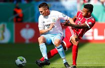 Bayern Munich’s Corentin Tolisso in action with Chemnitzer's Daniel Frahn (left)