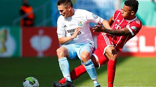 Bayern Munich’s Corentin Tolisso in action with Chemnitzer's Daniel Frahn (left)