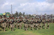 FILE PHOTO: Kurdish fighters from the People's Protection Units (YPG) take part in a military parade, in Qamishli, Syria, March 28, 2019.