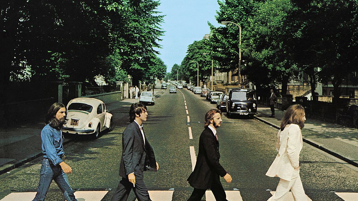Members of the Beatles, George Harrison, Paul McCartney, Ringo Starr, John Lennon, cross Abbey Road in London, Britain, August 8, 1969