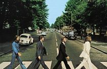 Members of the Beatles, George Harrison, Paul McCartney, Ringo Starr, John Lennon, cross Abbey Road in London, Britain, August 8, 1969