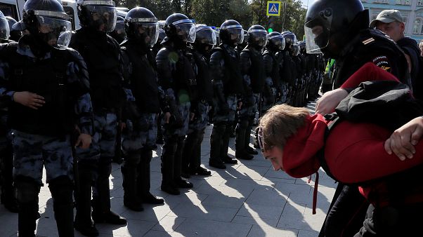 Law enforcement officers detain a participant in a rally calling for opposition candidates to be registered for elections to Moscow City Duma on August 3 Law enforcement officers detain a participant in a rally calling for opposition candidates to be registered for elections to Moscow City Duma on August 3