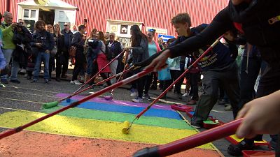 Residents paint street in colours of rainbow flag to celebrate Reykjavik Pride