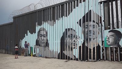 Border wall mural tells stories of Mexicans deported from US