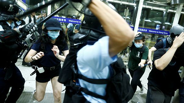 Police clash with protesters at Hong Kong International Airport Police clash with protesters at Hong Kong International Airport