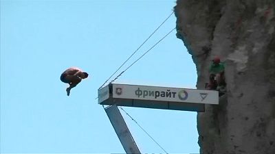 Divers compete in jumping off 27-metre cliff platform in Crimea
