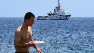 Italian PM says six EU countries have offered to take the stranded Open Arms migrants