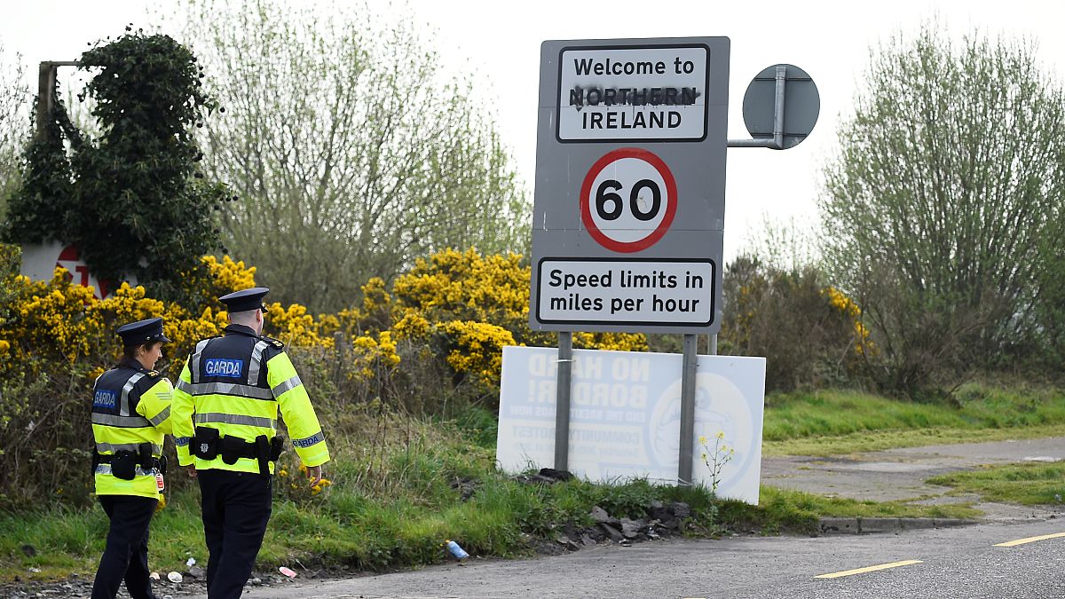 Irish police officers patrol along the border between Ireland and Northern Ireland