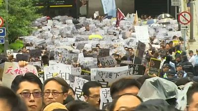 Hongkongers stage anti-government protests in the rain marking the eleventh week of demonstrations