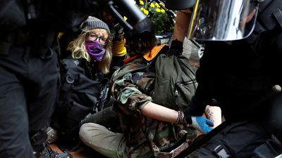 Far-right and anti-fascist groups clash at a rally in the American city of Portland