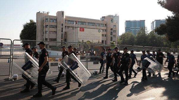 Turkish police walk in front of the Metropolitan Municipality headquarters in Diyarbakir, Turkey, August 19, 2019. Turkish police walk in front of the Metropolitan Municipality headquarters in Diyarbakir, Turkey, August 19, 2019.