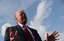 US President Donald Trump speaks to reporters before boarding Air Force One