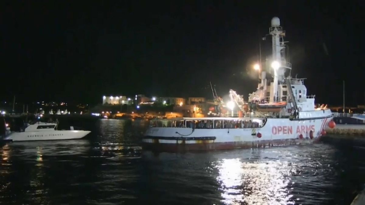 Migrants disembark in port of Lampedusa