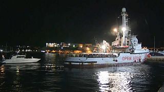 Migrants disembark in port of Lampedusa