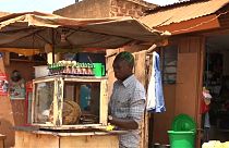 Street traders in Kampala work in shifts throughout the day and night