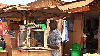 Street traders in Kampala work in shifts throughout the day and night