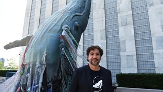 Javier Bardem posed next to the a 19ft tall sculpture representing threats to marine life