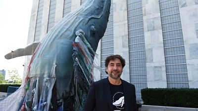 Javier Bardem posed next to the a 19ft tall sculpture representing threats to marine life Javier Bardem posed next to the a 19ft tall sculpture representing threats to marine life