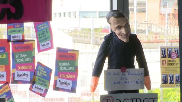 Una máscara del primer ministro francés en uno de los encunetros de la cumbre contra el G7 Una máscara del primer ministro francés en uno de los encunetros de la cumbre contra el G7